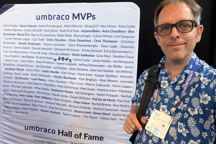 MVP Chris Houston Managing Director of Umbricians standing in front of list of Umbraco MVPs.