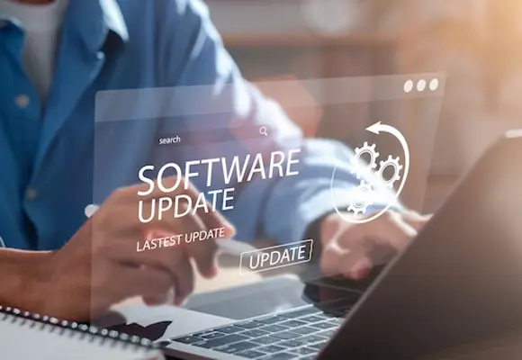 Man updating the software on his computer  to stay up to date with online security